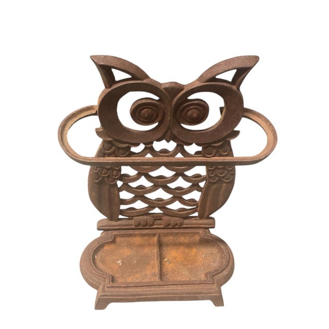 A vintage cast iron umbrella stand. Expertly cast in the form of a wide-eyed owl, this piece combines folk-art whimsy with...