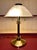 Stunning French Art Deco Style Table Lamp. Shade is of molded glass. Body is brass with a heavy counterweight underneath...
