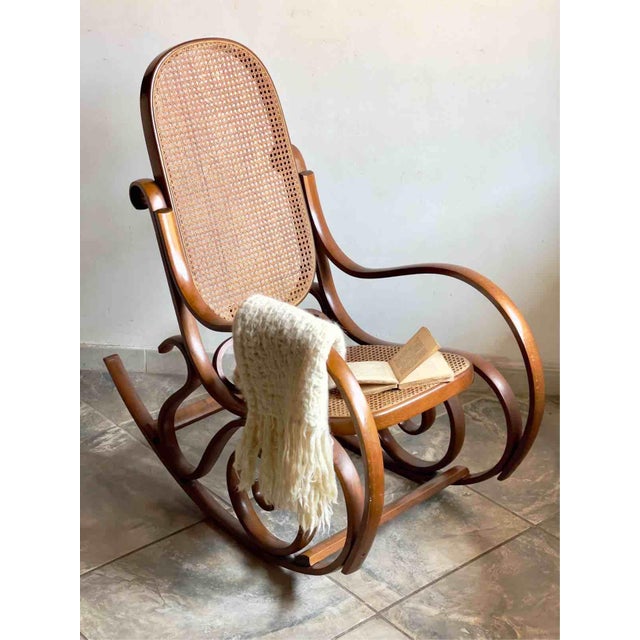 A charming vintage rocking chair dating back to the 1970s, faithfully reinterpreting the iconic Art Nouveau design...