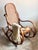 A charming vintage rocking chair dating back to the 1970s, faithfully reinterpreting the iconic Art Nouveau design...