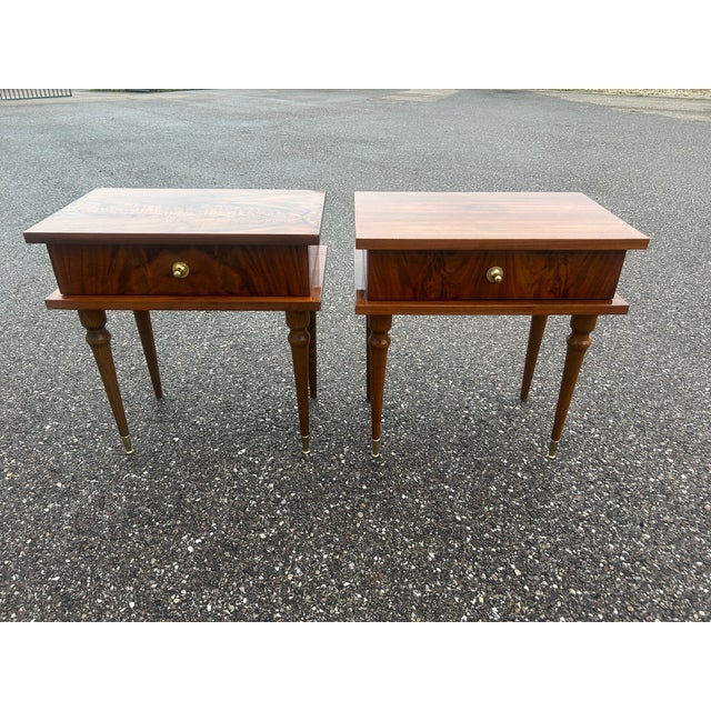 Pair of 1950s varnished rosewood bedside tables with brass drawer handles