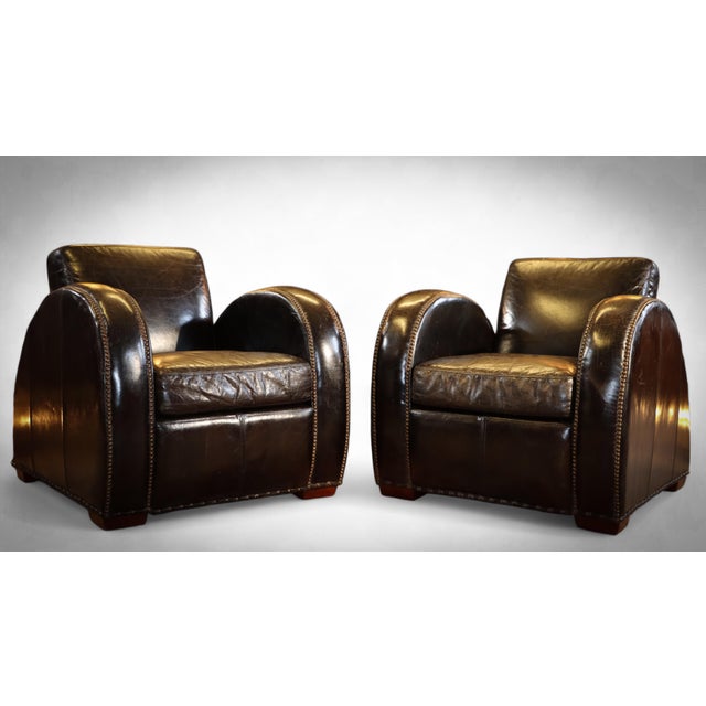 Up for grabs here is an absolutely stunning ultra rare pair of armchairs by timothy oulton halo. The original rockefeller...