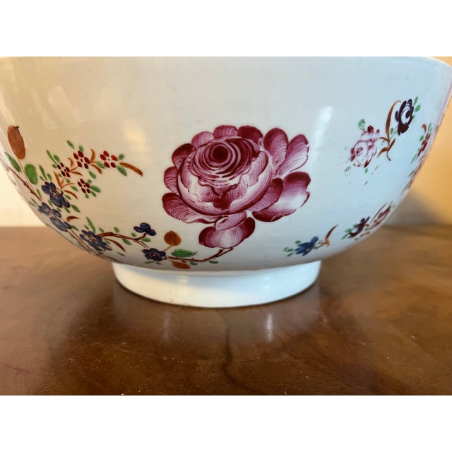 Large antique early 19th century Chinese export porcelain famille rose punch bowl painted with exuberant flowers. Measures...