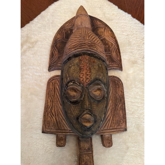 Kota reliquary guardian figure / Hand carved from solid wood and inlayed with copper bird figures and geometric patterns...
