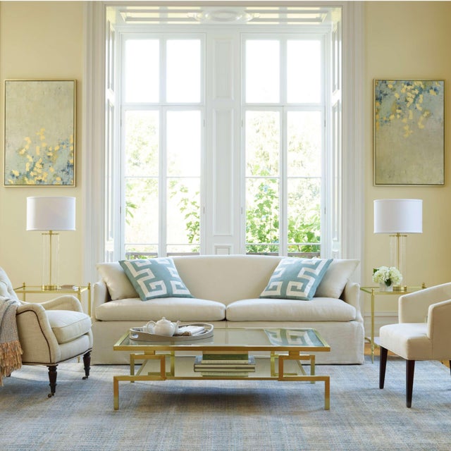 A subtle and refined grid pattern creates luster in pale blue and cream. The chic velvety sheen is achieved by some areas...