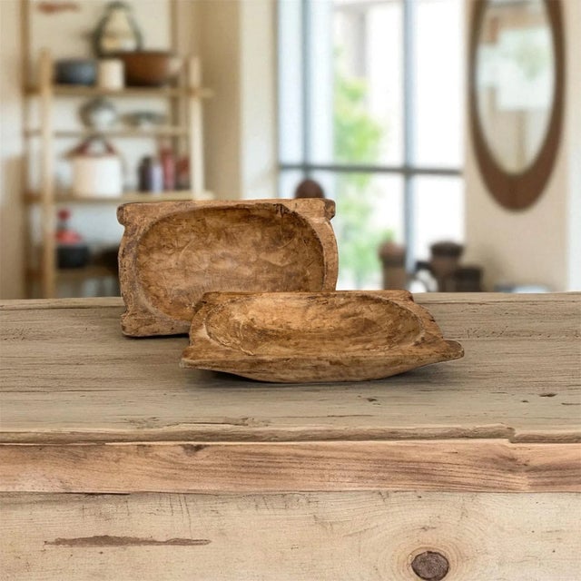 This pair of vintage hand-carved trenchers, also known as small dough bowls, dates to the mid-20th century and were made...