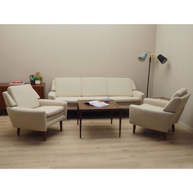 The sofa was made in the 1970s, Danish production. The structure of the furniture is made of solid wood. Legs made of...