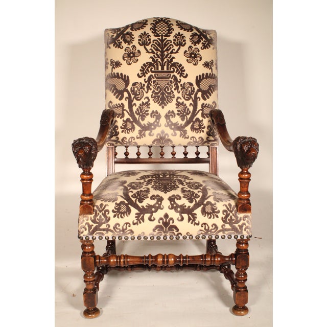 Pair of Baroque style carved walnut armchairs, circa 1900. With cut velvet upholstered backs with brass nail head trim,...