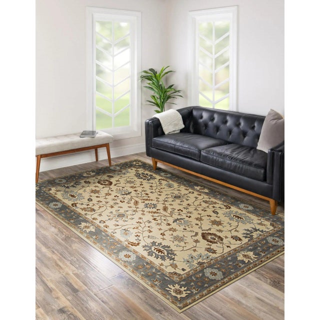 Opulent Oushak Ivory Hand Knotted Wool Rug, Country of Origin: India. This magnificent piece captures the grandeur of...