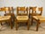 Set of 6 solid oak chairs with woven straw seats, designed by Charlotte Perriand in the 1960s. The chairs have been...