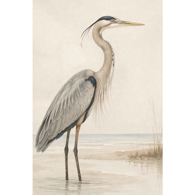 Refined coastal artwork featuring a great blue heron standing in shallow water against a soft, misty shoreline. The...