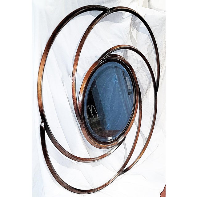 Get your spin on with this circular beveled wall mirror, a budding flower from above or a whirling dervish, guaranteed to...
