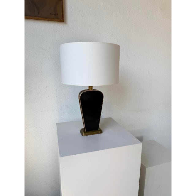Old black lacquered table lamp with its brass-plated metal details, from Diderot editions, Sarco model (label under the...