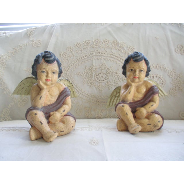 This is a Fabulous! Vintage Italian Pair of Cherubs in the Tuscan Style with a Antique Finish that have Dark Hair and...