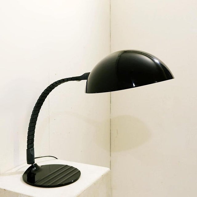 Black Model 660 Table Lamp by Elio Martinelli for Martinelli Luce Wear consistent with age and use Measures : 26cmx26cm...