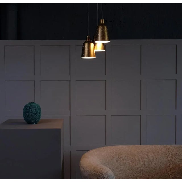 Rare Model. Produced by Ateljé Lyktan, Åhus, Sweden, 1950s. Rewired. Height is adjustable. Perforated brass. This piece is...