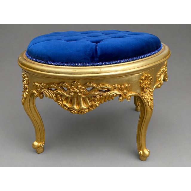 A striking 1980s Italian Rococo Revival bench, handcrafted in solid beechwood with an ornate antique gold finish and newly...