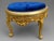 A striking 1980s Italian Rococo Revival bench, handcrafted in solid beechwood with an ornate antique gold finish and newly...
