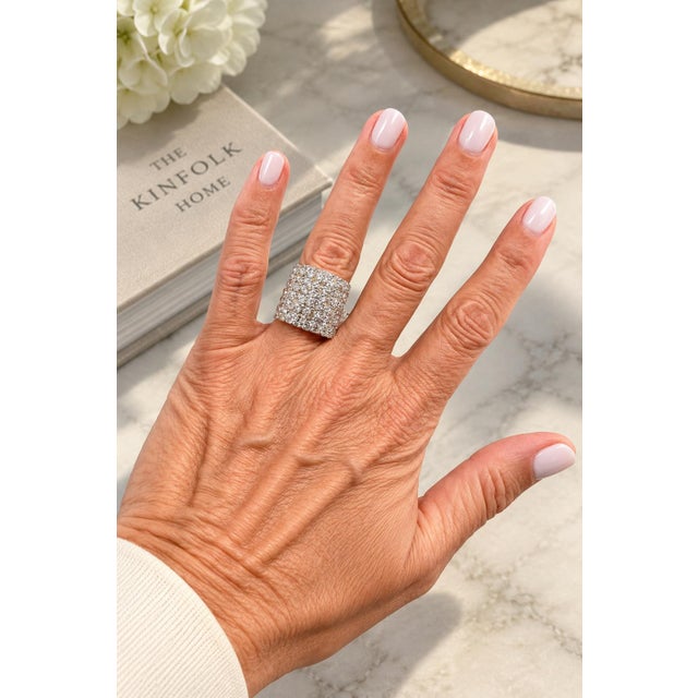 An impressive vintage bombe cocktail ring crafted in 18 karat white gold and set with fifty-six round brilliant diamonds...