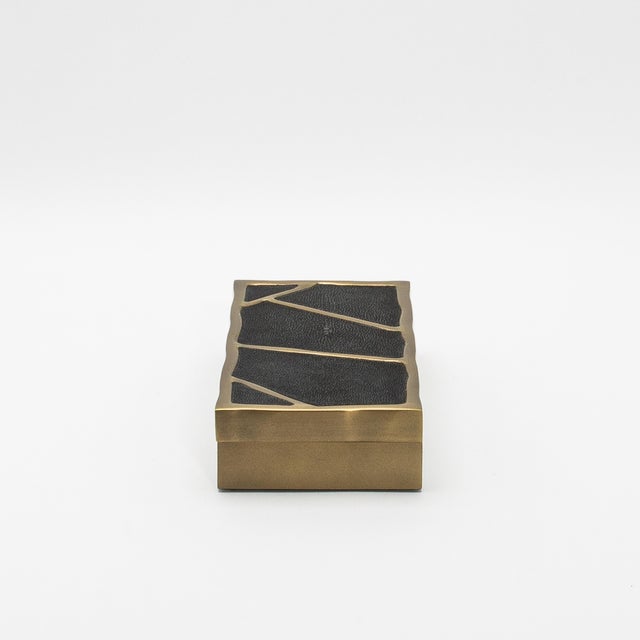 The "Melting Box" by R&Y Augousti is a masterful creation, combining luxurious materials and elegant design into a...