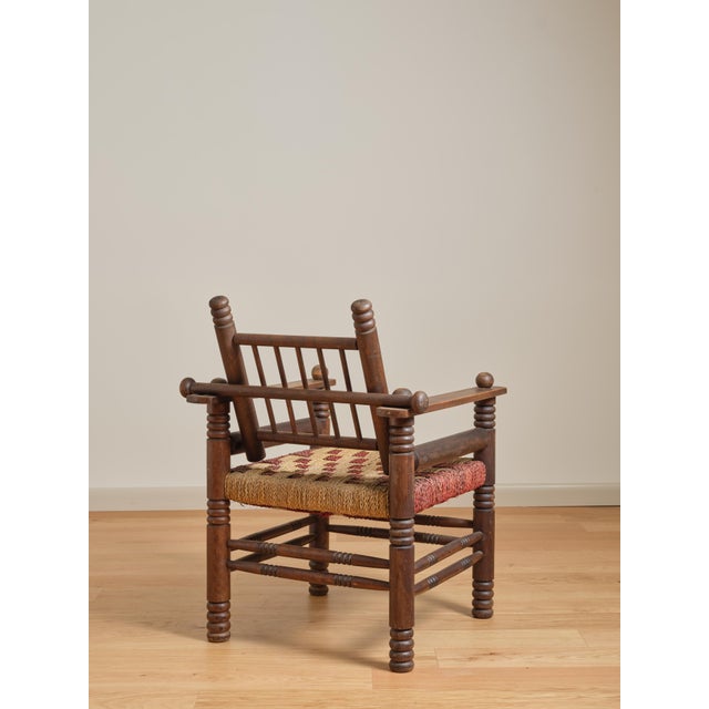 Red and white checkered seat Adjustable slat back folds forward onto seat C. 1940's Not signed.