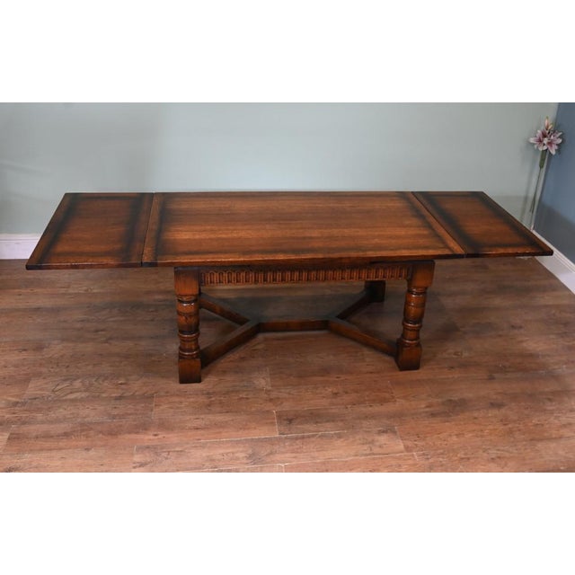 Well this really is the piece de resistance in farmhouse kitchen dining A gorgeous extending oak refectory table with a...