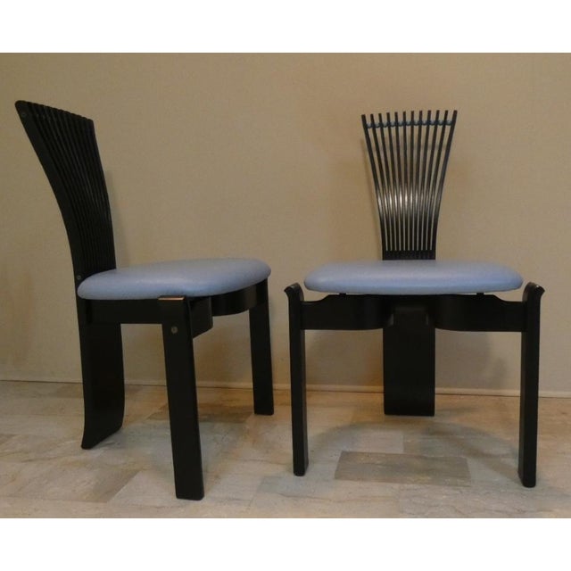 Totem is a sculptural postmodern style chair with a geometric and minimalist design. Made of black lacquered curved wood...