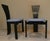 Totem is a sculptural postmodern style chair with a geometric and minimalist design. Made of black lacquered curved wood...