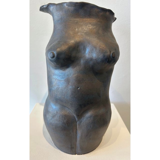 Large sculpture of female bust, signed and dated Sid K. 4-29-90 on back left thigh. Natural interiors.