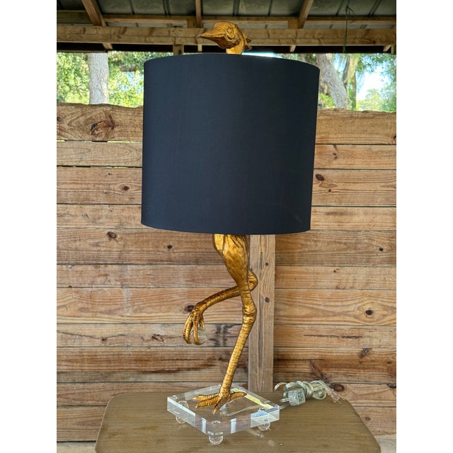 A bold and sculptural statement piece by Cyan Design, this monumental ibis buffet lamp stands an impressive 35 inches...