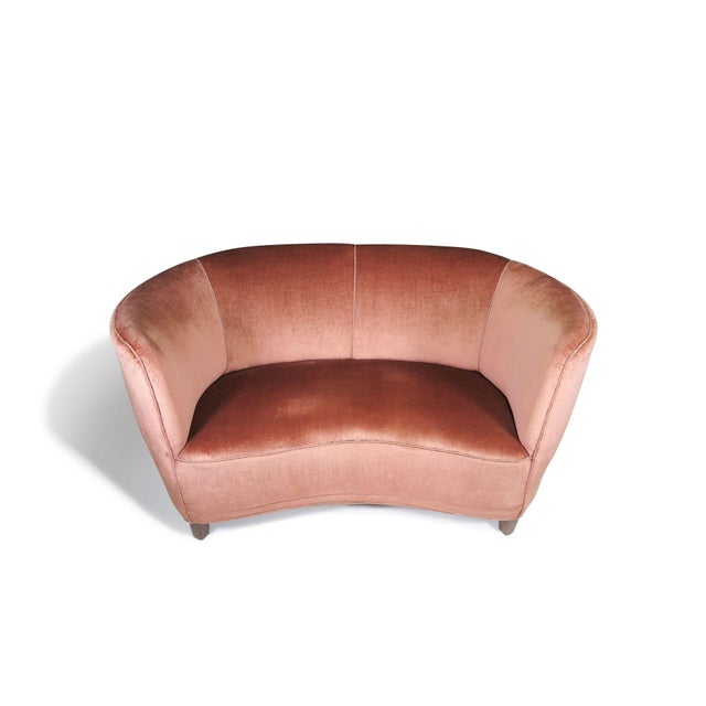 1930's Danish Deco curved sofa crafted of a solid wood frame with eight-way hand-tied springs, horsehair and cotton...