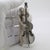Large and rare vintage solid silver figurine depicting a cellist performing with his instrument, handcrafted in Arezzo,...