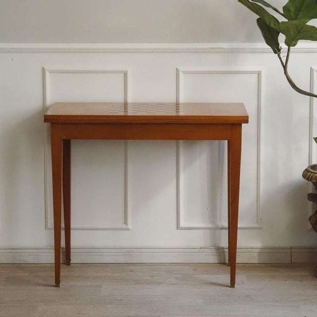 Antique folding table made of cherry wood with an integrated chessboard surface, a fold-out playing surface, and an olive-...