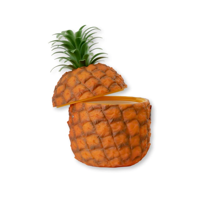 Mid 20th century English pineapple ice bucket produced for Britvic, featuring a bold molded form with vibrant orange body...
