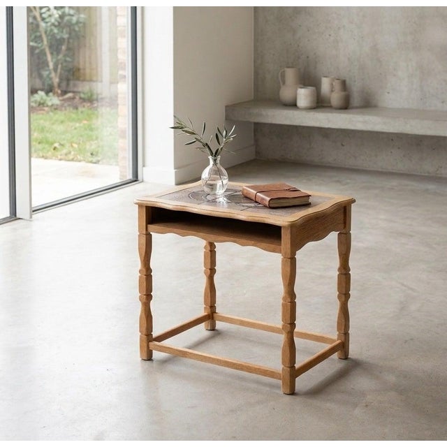 Striking Danish brutalist side or bedside table from the 1960s, crafted in oak and featuring a tiled tabletop. The...