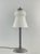 H. Fournet & Schneider A French art deco lamp in wrought iron. The forged base holds a rare model Schneider shade in...