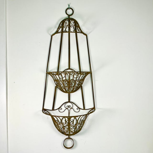 We curated this gorgeous wall mounted two-tiered jardiniere planter while traveling in Italy many years ago. It hung...