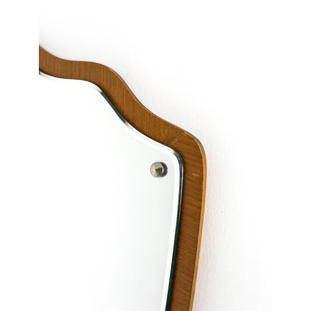 This elegant Swedish Modern wall mirror from the 1950s exemplifies the restrained sophistication and organic sensibility...