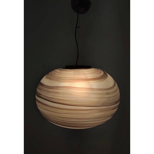 Made in Italy, 1970s - 1980s. This pendant features and mold-blown etched glass shades with brown brush strokes. They are...