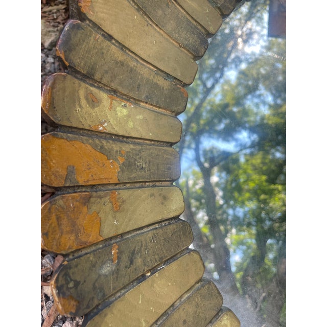 This exceptional 1950s Hollywood Regency oval wall mirror is a verified design by the renowned Spanish master cabinetmaker...