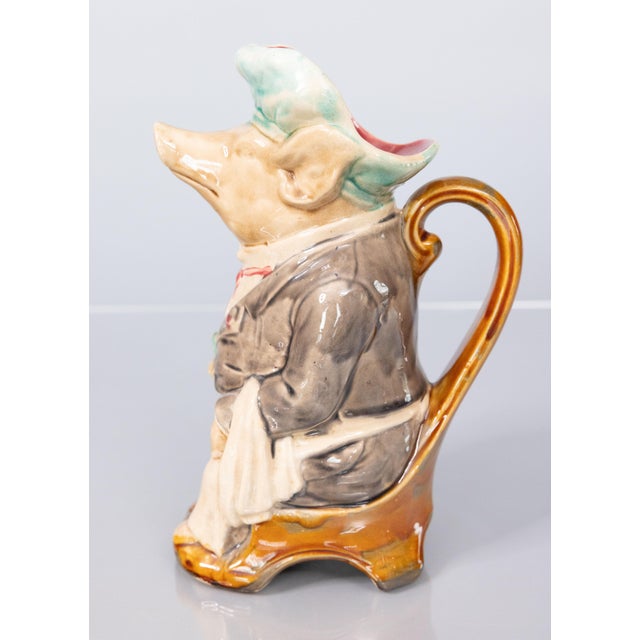 A superb antique French majolica barbotine pig waiter pitcher by Onnaing, circa 1880. This delightful pitcher is designed...