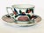 Japanese Arita porcelain cup and saucer set featuring traditional Imari ware decoration, characterized by its hand-painted...