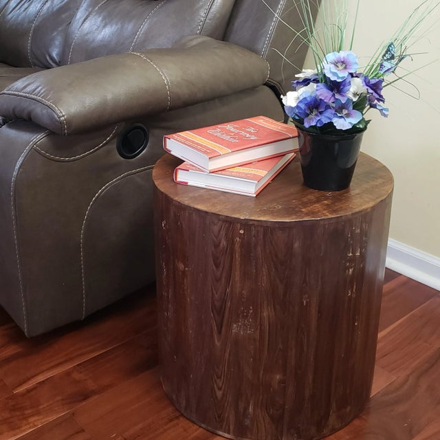 This exotic reclaimed solid wood 18-inch cylindrical accent table will add an eye-catching style to your living room or...