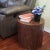 This exotic reclaimed solid wood 18-inch cylindrical accent table will add an eye-catching style to your living room or...
