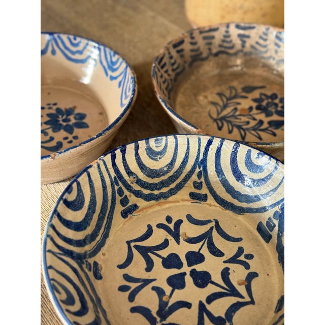 Vessels of time, these Fajalauza bowls have traveled through centuries from the hillside workshops of Granada, where...