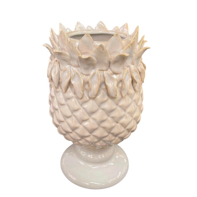 This charming, small vintage pedestal vase, expertly crafted in Italy, showcases a delightful botanical-inspired design...