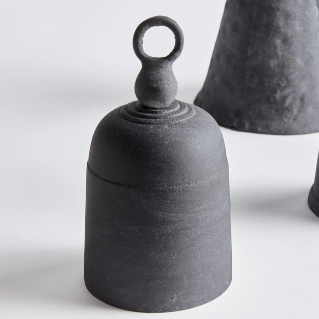 Old fashioned objets in cast aluminum, these historic shapes are functional bells. Place this unique trio atop a stack of...
