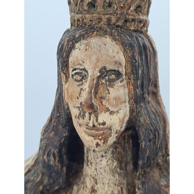 A unique, hand-carved figure of the Virgin Mary with the Infant Jesus, made of linden wood and dating from the first half...