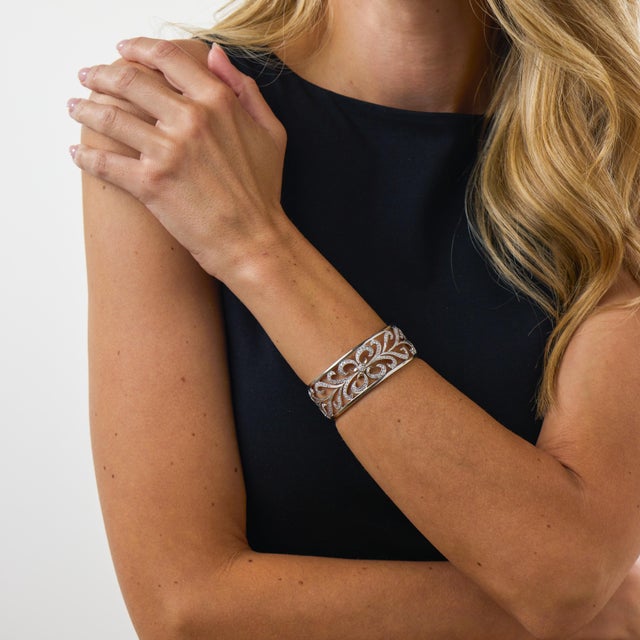 This striking vintage diamond cuff bracelet is an elegant design from the 2000s, beautifully crafted in polished 18k white...