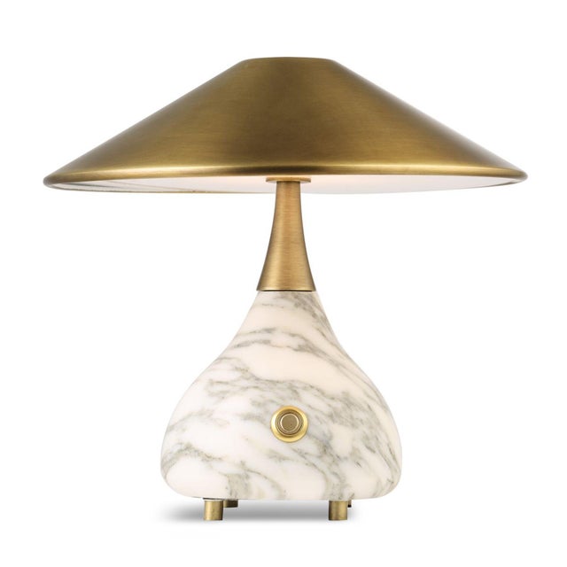 This sculptural mini table lamp combines style with convenient cordless function, featuring a softly tapered shade and...